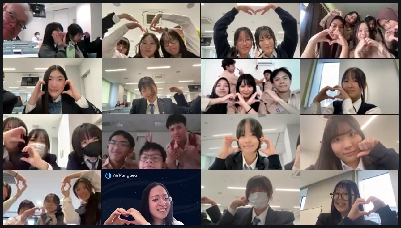 オンライン協働の Zoom の画面。両国の生徒が画面ごとに手でハートの形をつくっている